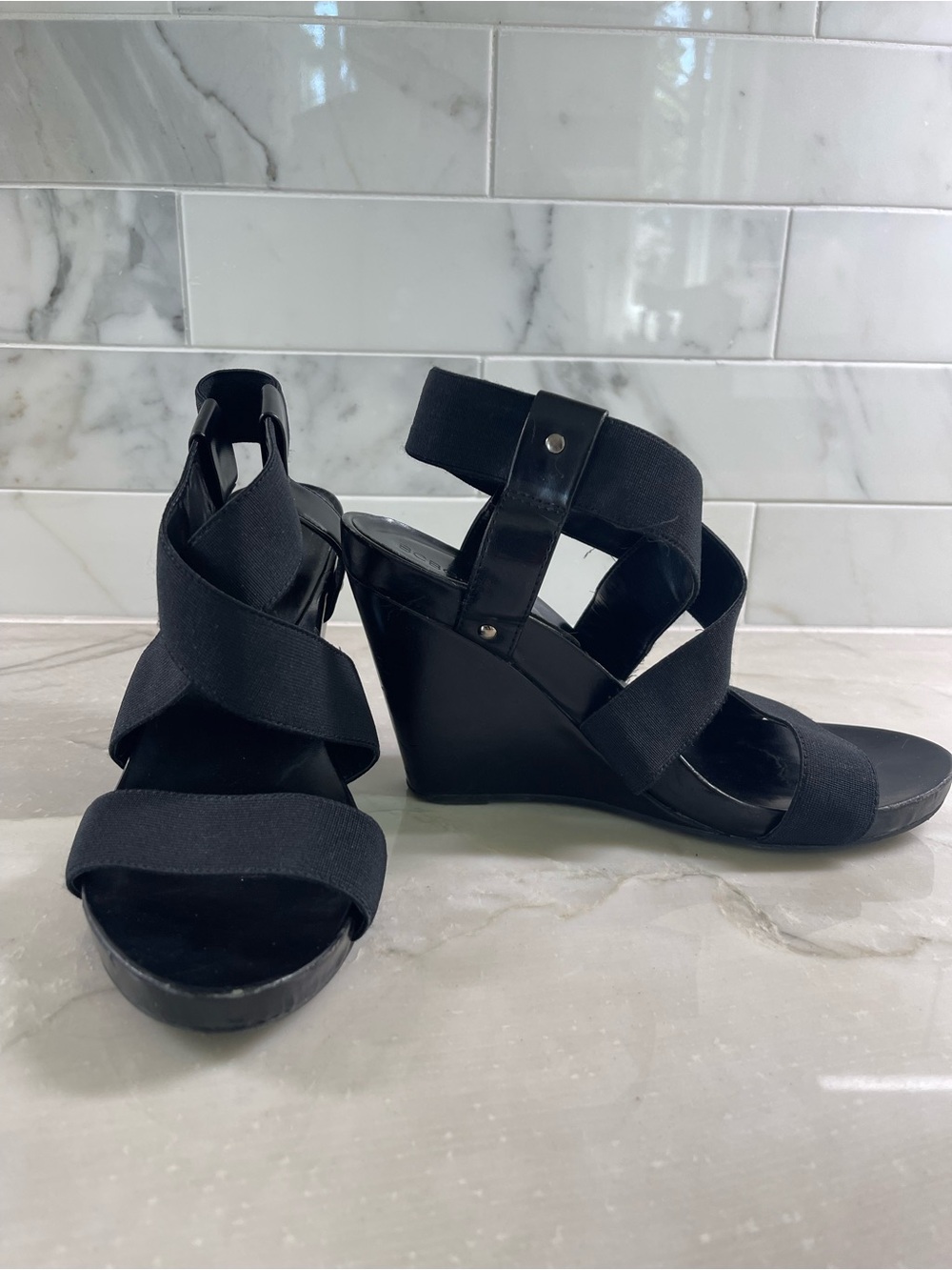 BCBGeneration Black Elastic Crossover Wedge Sandals